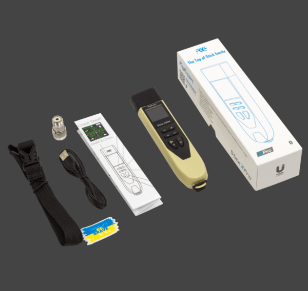 Digital breathalyzer kit with accessories and packaging on a gray background.