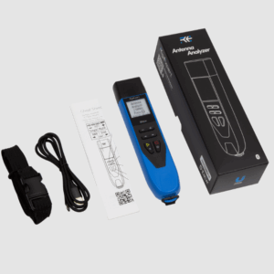 Portable antenna analyzer with display, cables, and instruction manual.