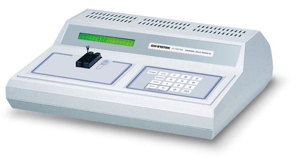 wp-image366.png White IC tester device with green display screen and numeric keypad interface.