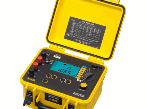 Portable yellow digital insulation resistance tester with display screen and test lead ports.