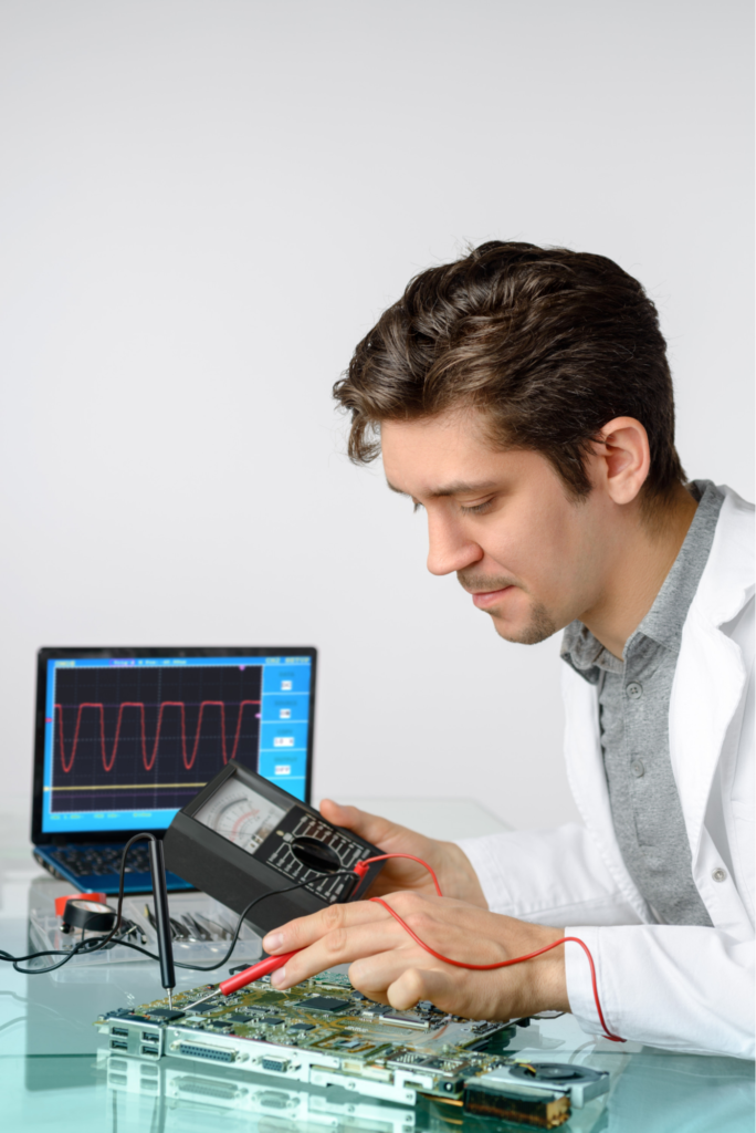 A technician using electronic reading equipment.